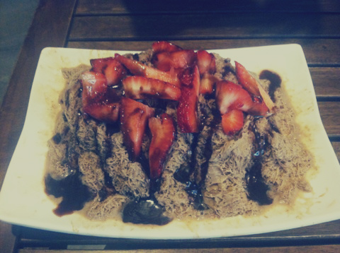 Mocha snow with fresh strawberries and chocolate sauce.